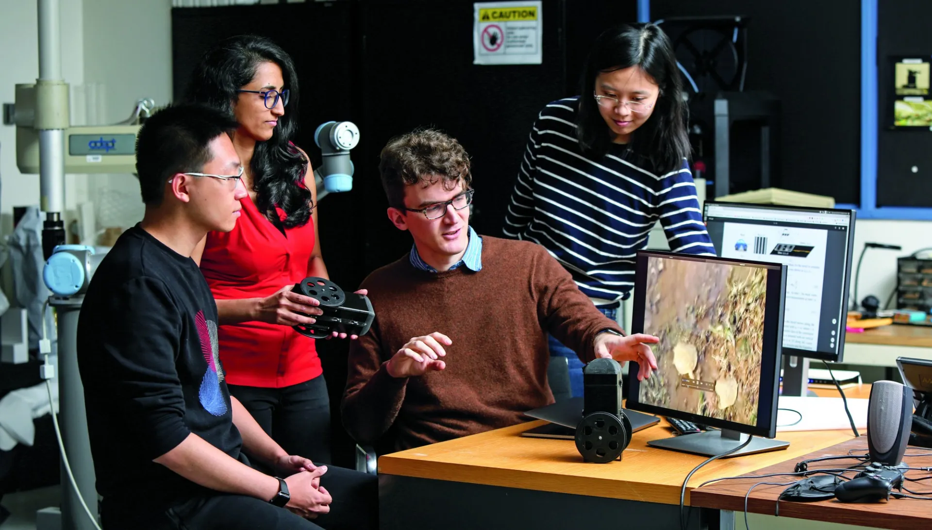 Students conducting research in a lab.