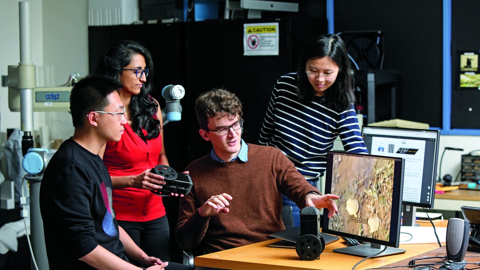 Columbia Engineering students working together with lab equipment