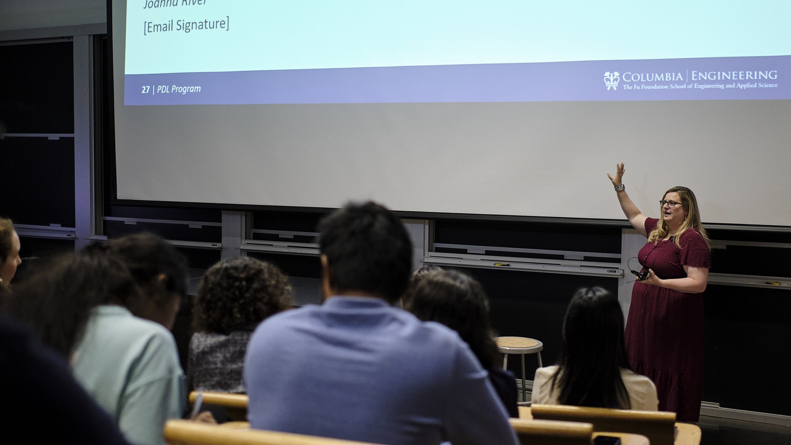 An instructor leading a PDL session in a Columbia Engineering lecture hall